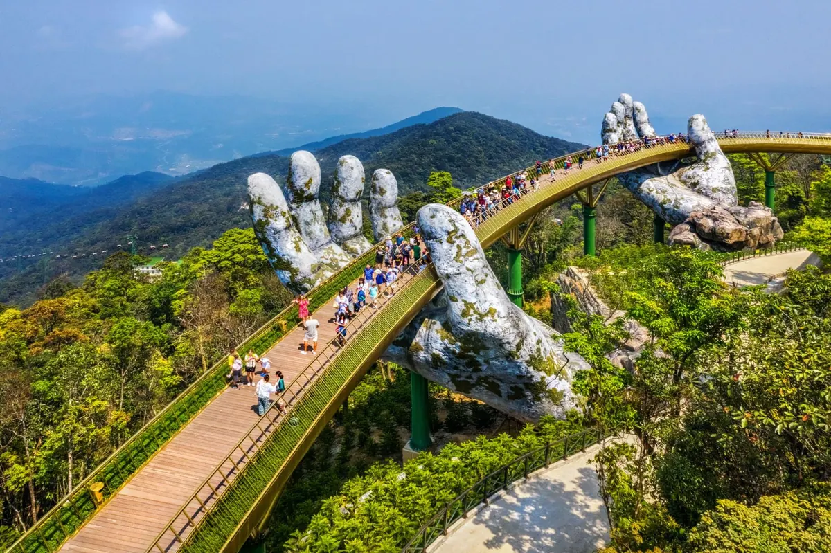 Golden Bridge held by giant stone hands at Ba Na Hills, Da Nang